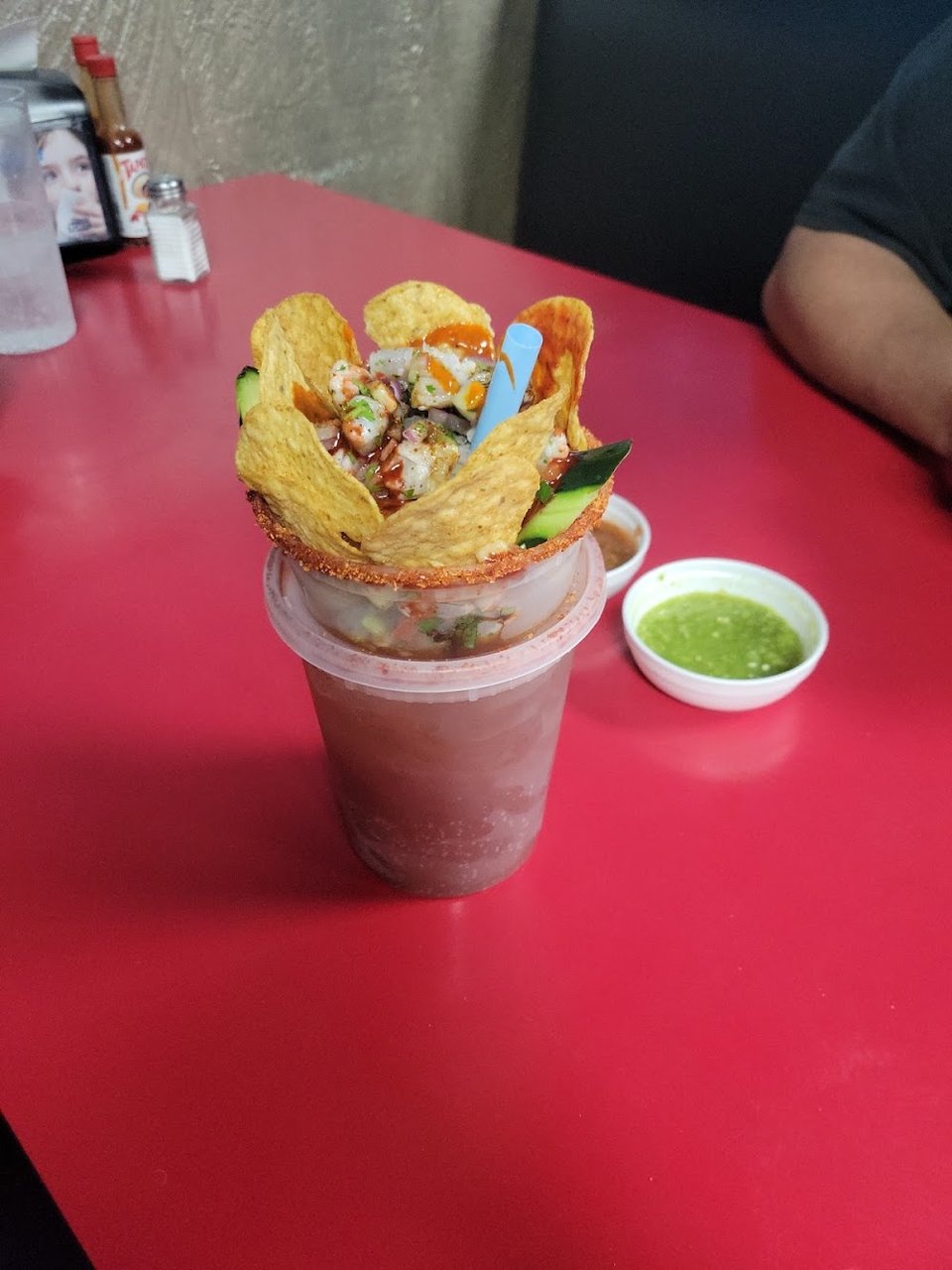 Beverage choices beside extra side dishes.